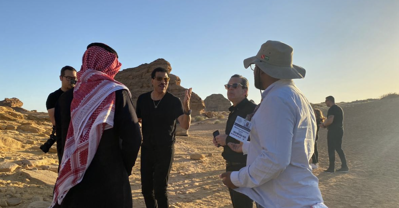 Walid Sanchez coordinating an AlUla site visit with Lionel Richie and the guest team