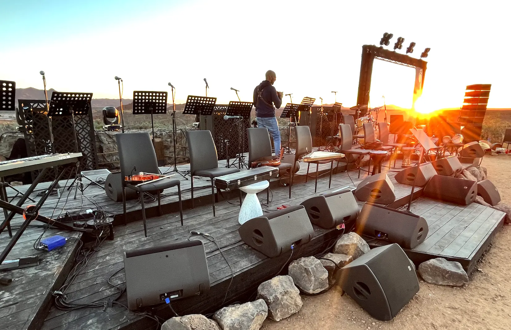 Musicians’ chairs, microphones and sound equipment arranged on the outdoor stage